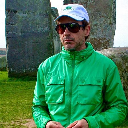 Robert Downey Jr. wearing a blue cap and green jacket